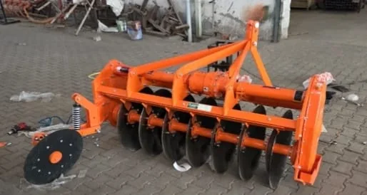 Orange agricultural rotavator