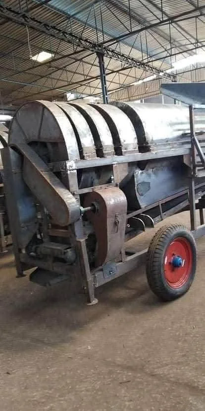 Metal thresher machine in workshop